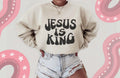 Jesus Is King Graphic on Gildan Softstyle Sand Shirt – Graphic Tee, Long Sleeve & Crewneck.